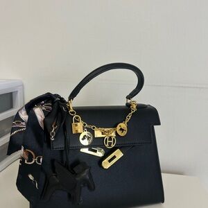 Hermes Black Satchel with Gold Accents